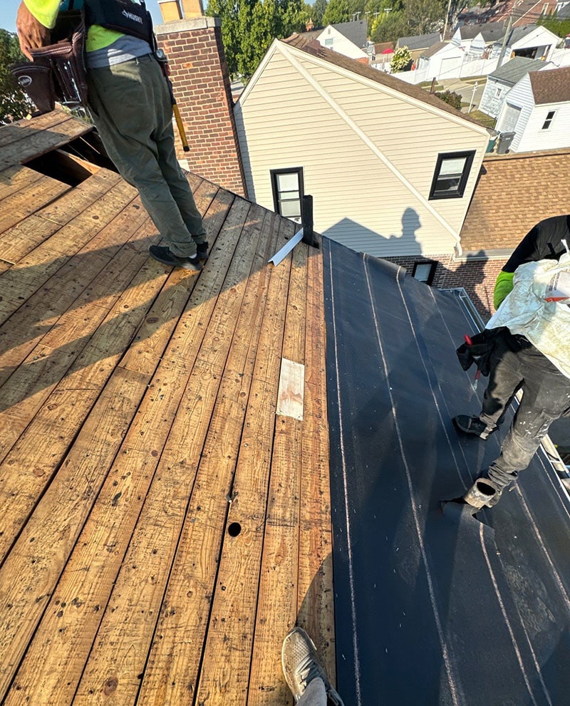 Performance Roofing and Siding staff on a process of roof replacement in Michigan