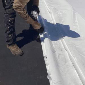 commercial roofing contractor in a process of flat roof replacement in Michigan