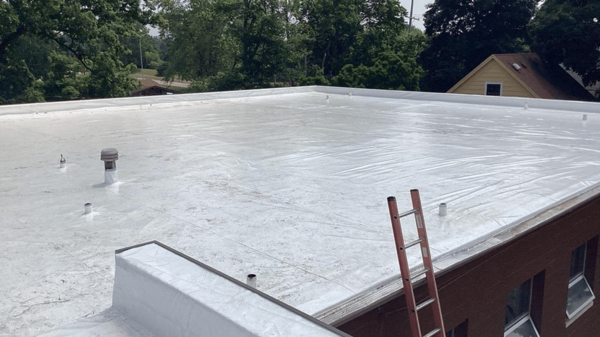 A newly installed flat roof by a commercial roofing contractor in Michigan