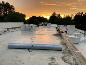 commercial roofing contractor on a process of installing a new Flat Roof in Pontiac, MI