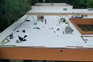 commercial roofing contractor on a process of installing a new Flat Roof in Pontiac, MI