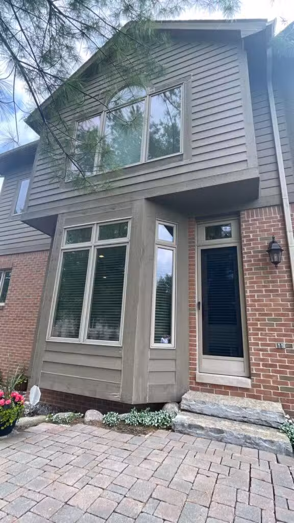 Expert performing a siding inspection to compare James Hardie and LP siding durability.