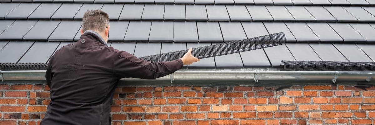 Gutter installation with leaf guard by Performance Roofing & Siding