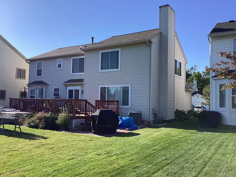 Two-story home with modern siding and roofing upgrades by Performance Roofing and Siding in Michigan