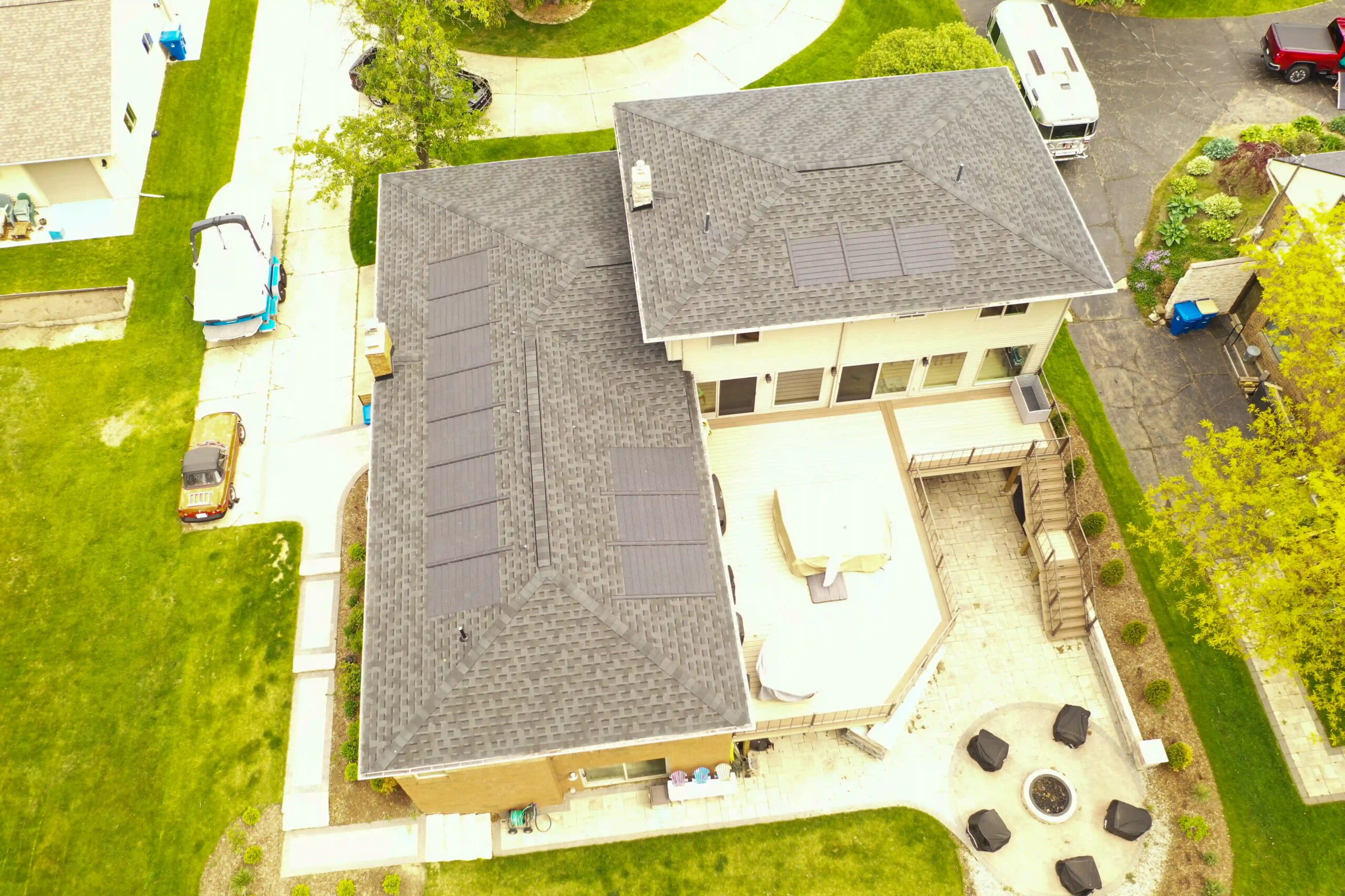Top view of residential roof fitted with solar shingles by Performance Roofing and Siding in Ann Arbor, Grand Rapids, and Pontiac