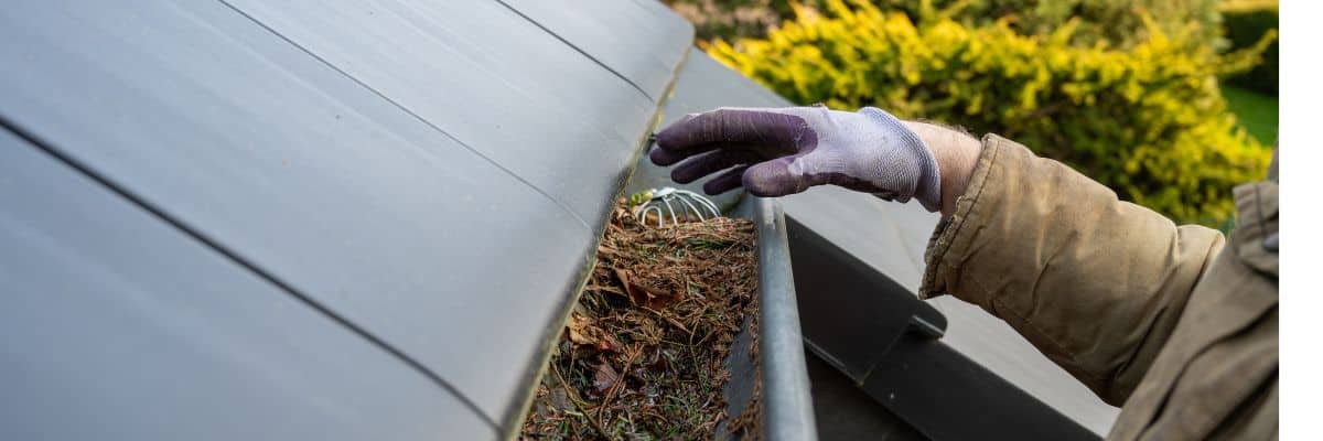 Clogged gutter cleanout by Performance Roofing and Siding