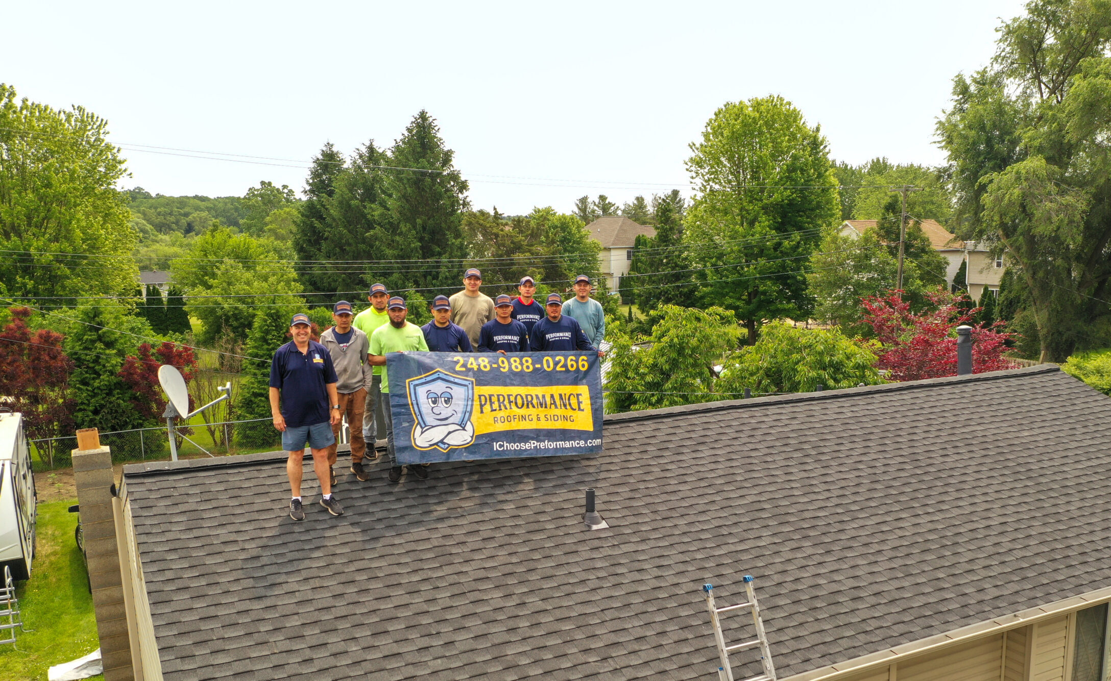 Aerial view of Performance Roofing & Siding team assembled on-site in Novi, MI