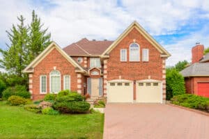 A brown roof is the best color for roof shingles for a red brick house