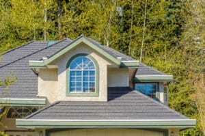 Dark shingles with light house is an expert tip for hot to choose a roofing style